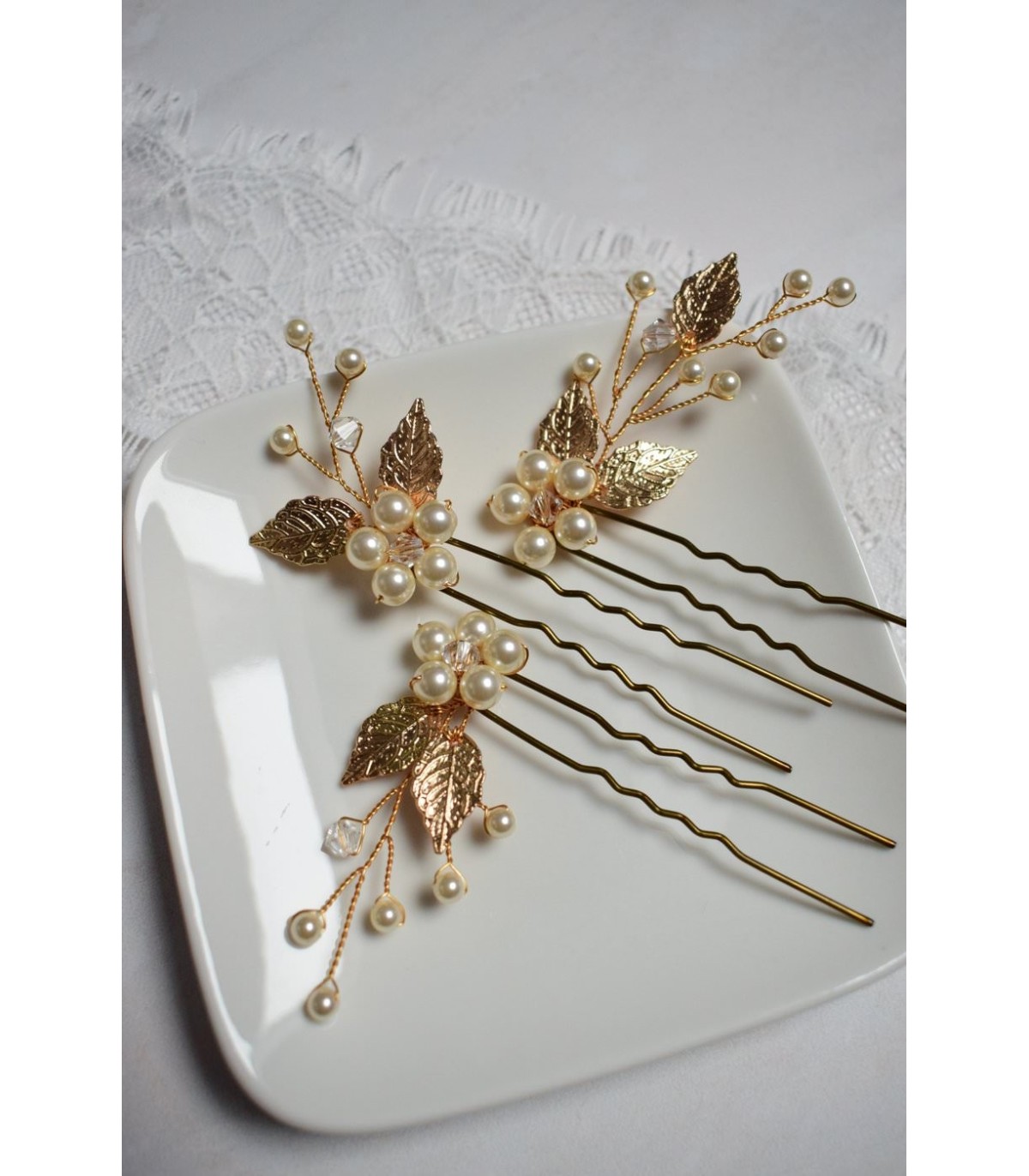 Pics à cheveux Zen pour la mariée avec des feuilles et des perles nacrées