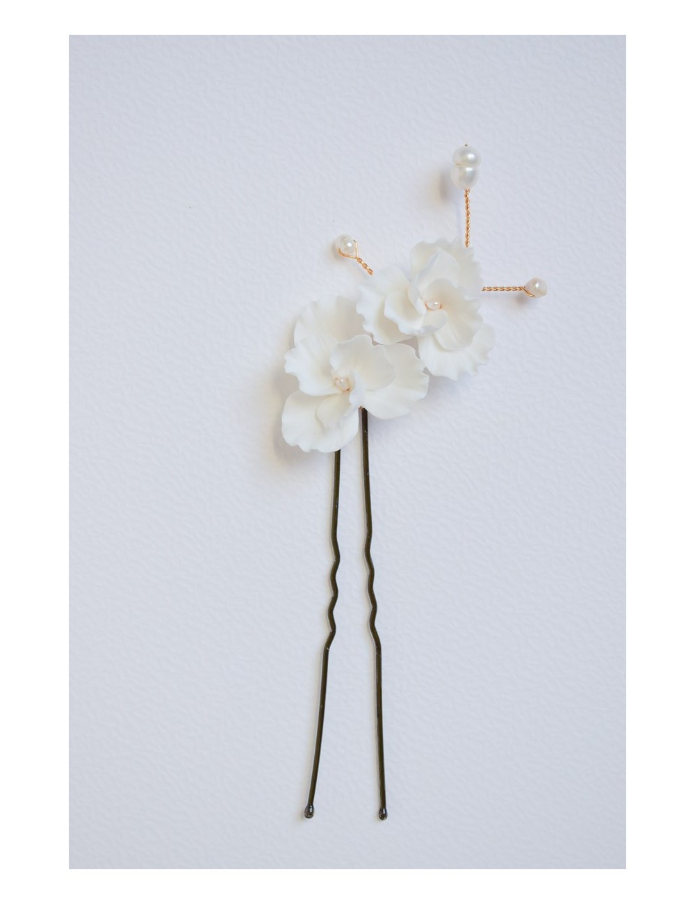 Pic à cheveux Chantilly pour le chignon de la mariée.